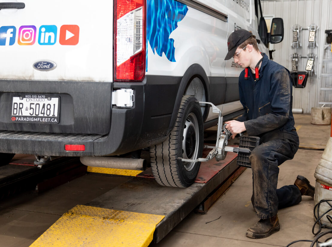 man measuring tire